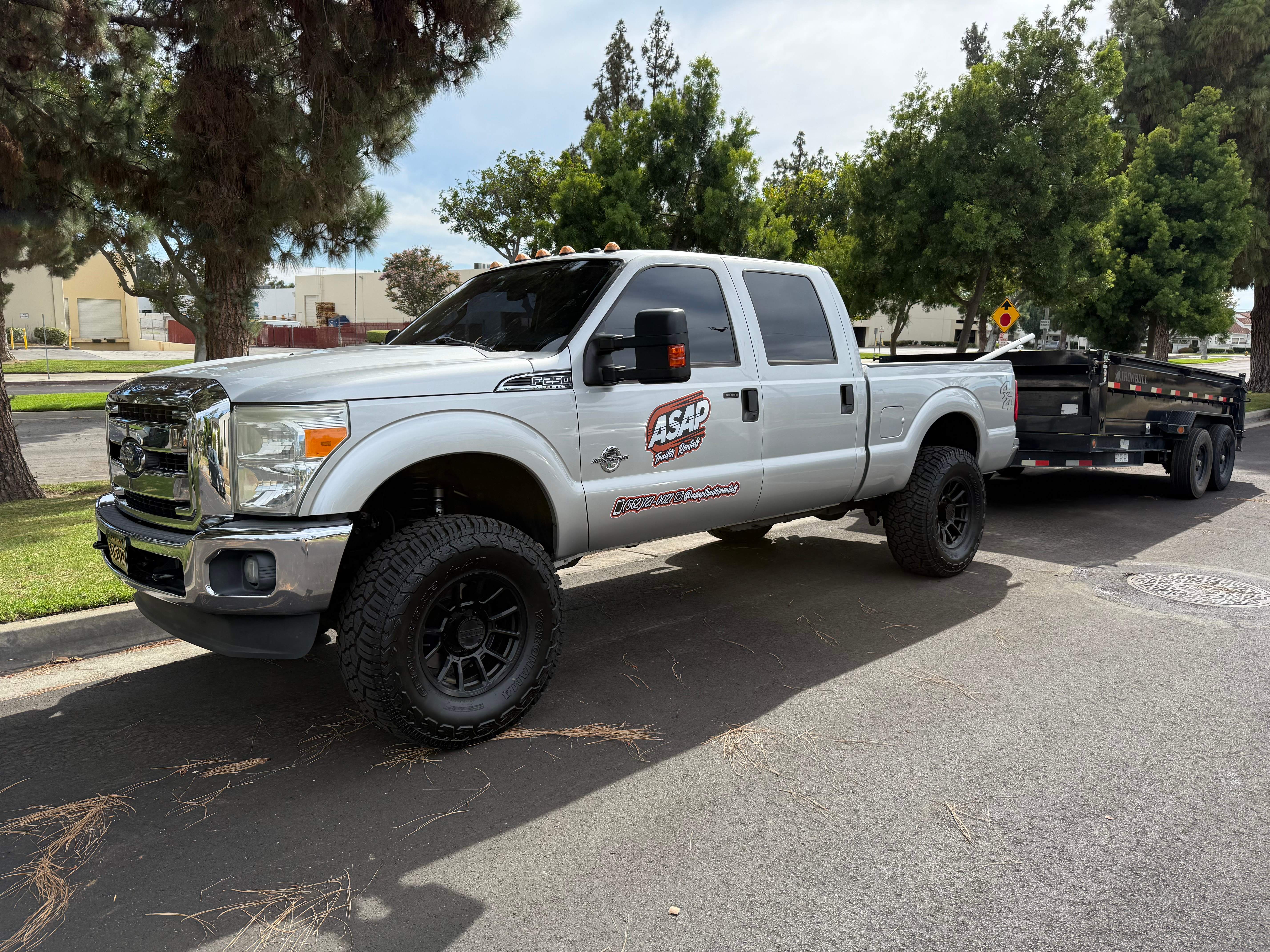 ASAP Trailer Rentals truck hauling Iron Bull dump trailer in Norwalk, California - Professional trailer rental service